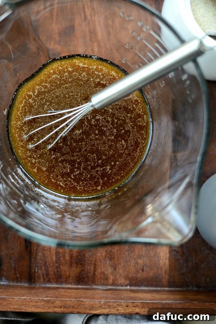Whisking sesame ginger dressing ingredients