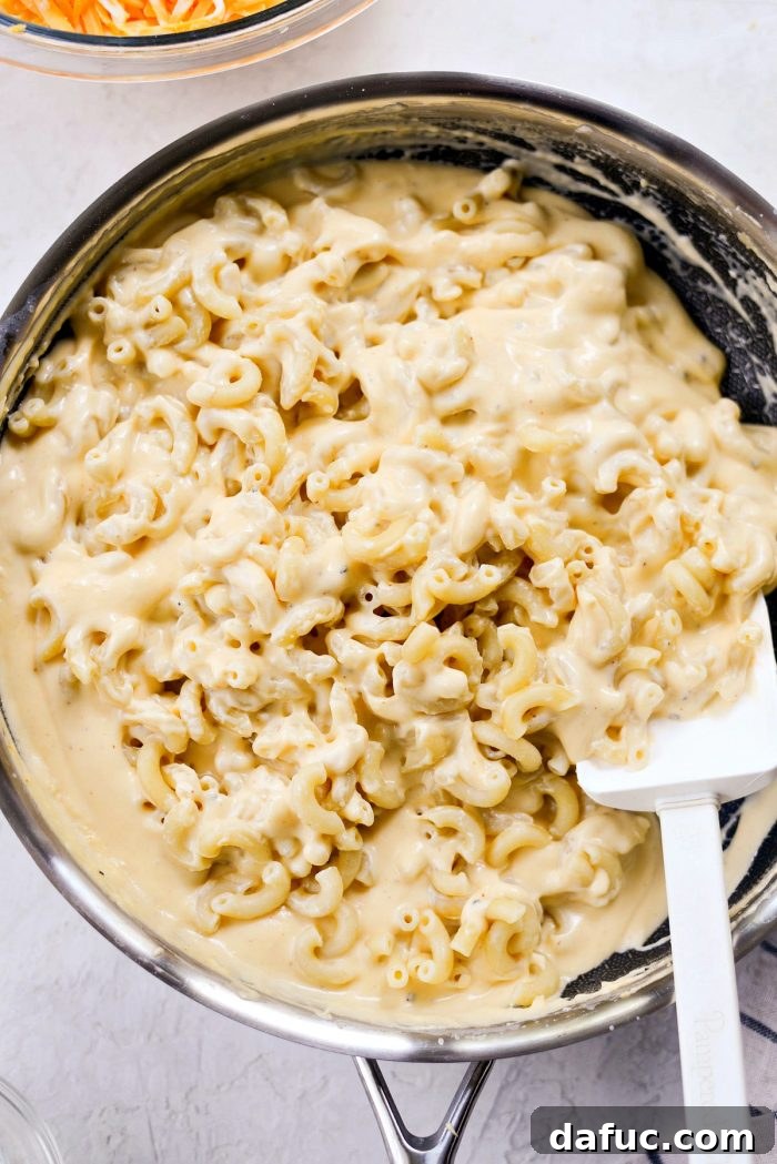 Adding Partially Cooked Pasta to Smooth Cheese Sauce