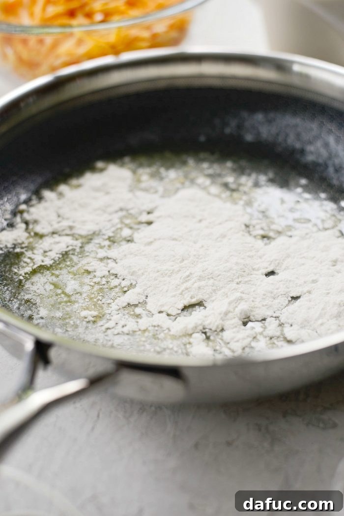 Melting Unsalted Butter in a Skillet for Mac and Cheese Sauce