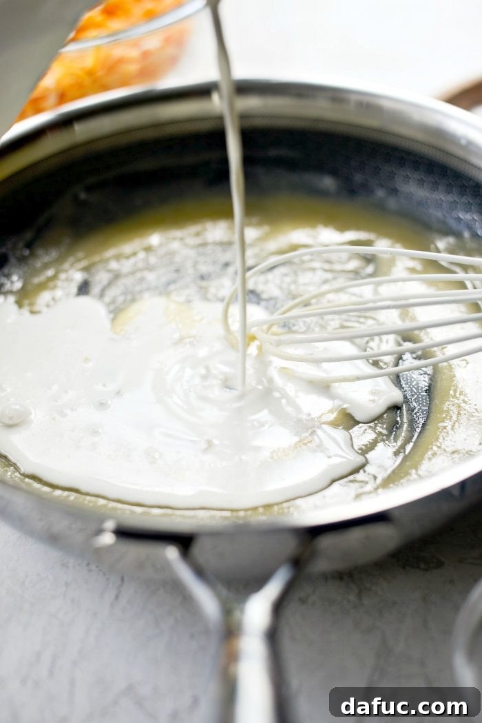 Whisking Flour and Butter for a Perfect Roux in Mac and Cheese