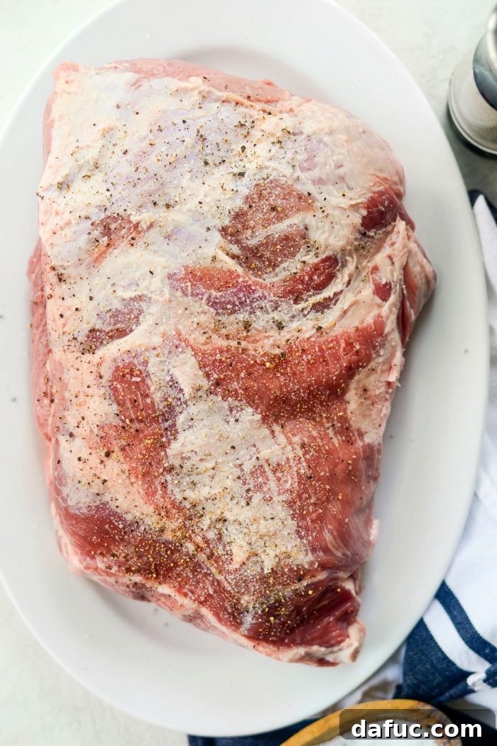 Seasoned pork shoulder ready for searing