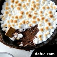 Skillet S'mores Dip with perfectly toasted marshmallows and melted chocolate.