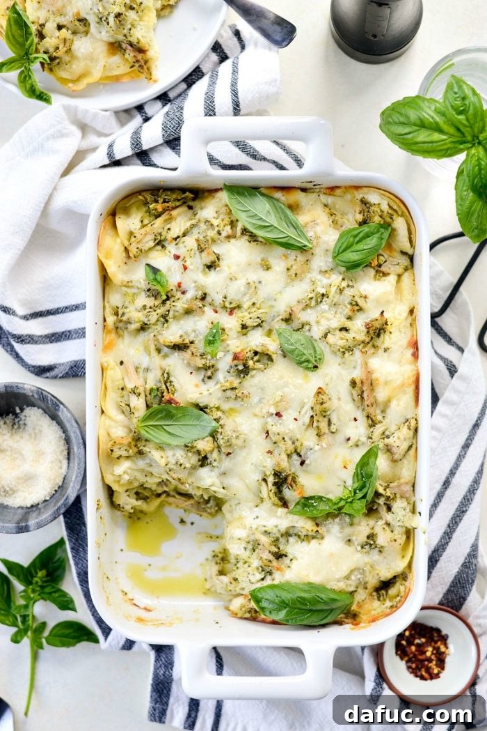 Pesto Chicken Ravioli Lasagna Bake 2 Pesto Chicken Ravioli Lasagna - Layers of chicken, pesto, ravioli, ricotta, and béchamel sauce for an easy and comforting dinner