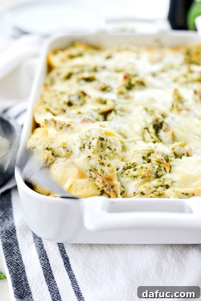 Pesto Chicken Ravioli Lasagna Bake 16 A slice of Pesto Chicken Ravioli Lasagna showing off its creamy layers