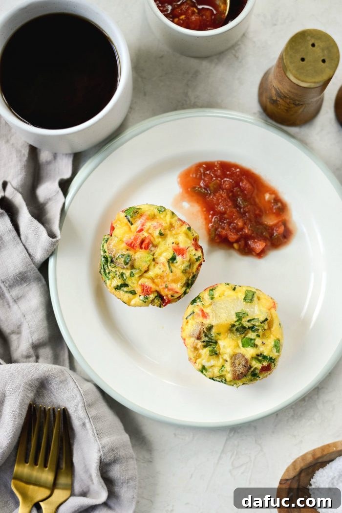 Close-up of freshly baked mini frittatas in a muffin tin, ready for busy mornings