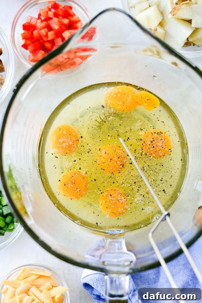 Mixing bowl with eggs and seasonings for frittatas