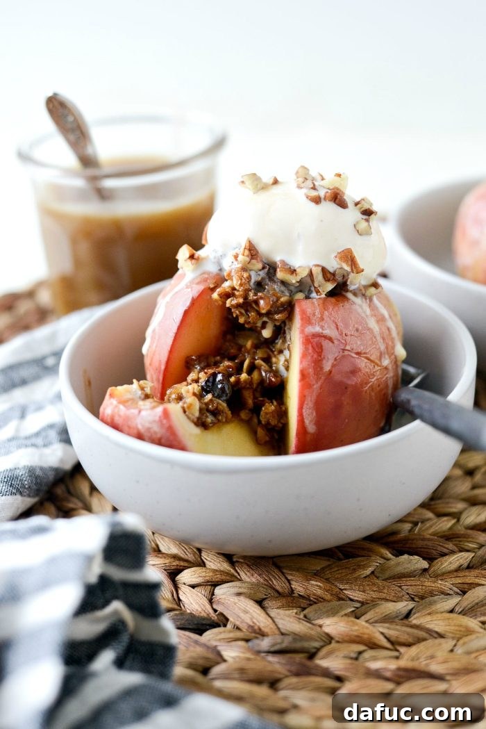 Close-up of baked apples with melted ice cream and sauce
