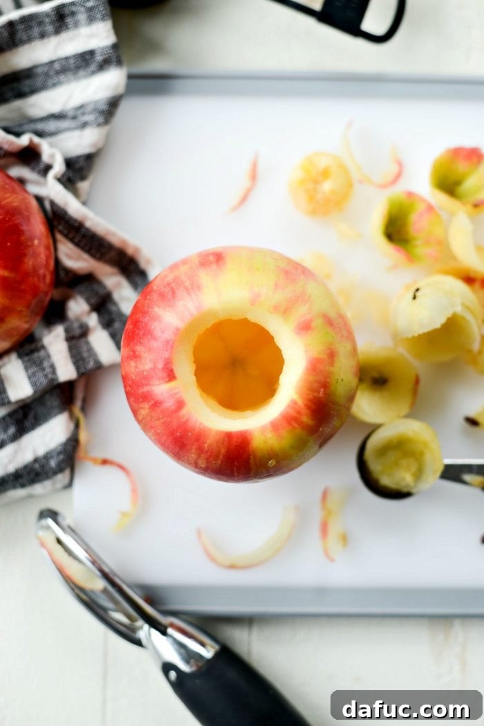 Hollowing out apples with a melon baller for baking