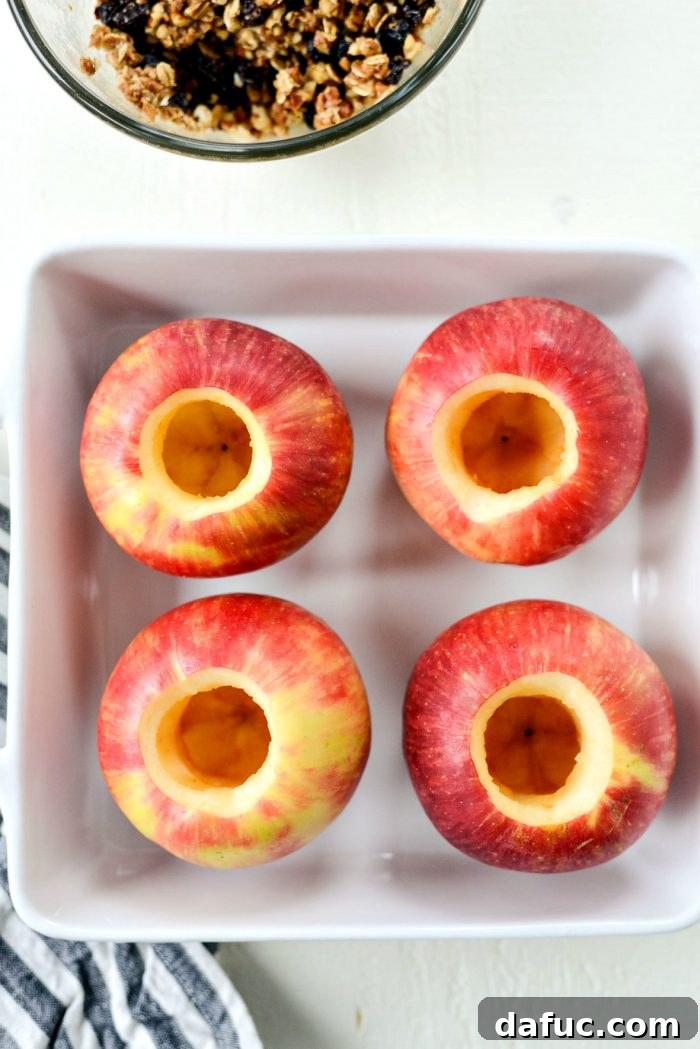 Trimming the top of apples with a vegetable peeler for a neat opening