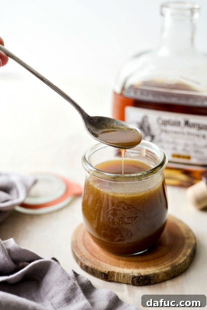 Final shot of Homemade Butter Rum Sauce in a stylish setting, showcasing its golden color and inviting texture.