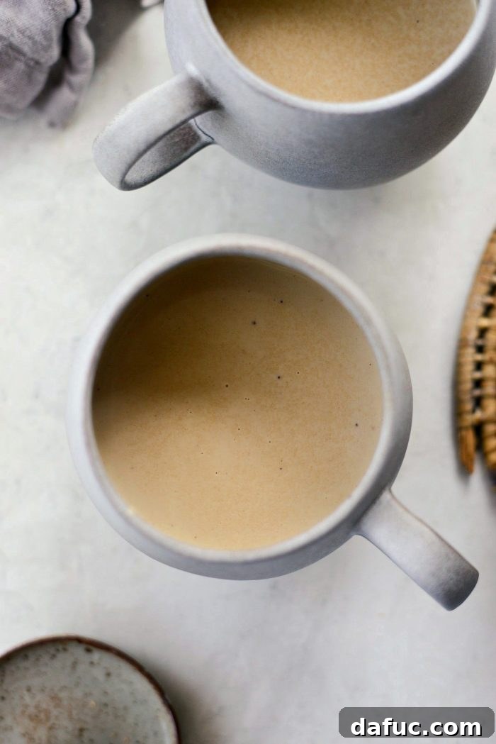 Cozy Pumpkin Chai Dream 14 Two mugs filled with Pumpkin Spice Chai Latte