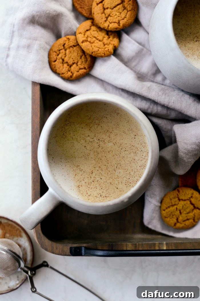 Cozy Pumpkin Chai Dream 20 Close-up of a Pumpkin Spice Chai Latte with frothed milk
