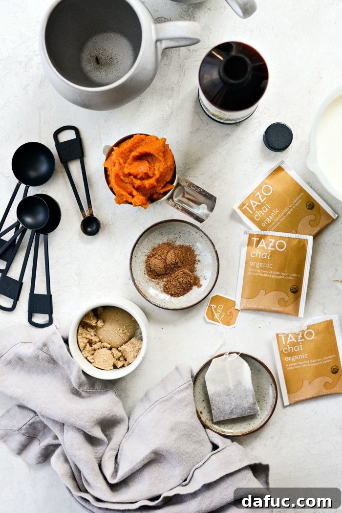 Cozy Pumpkin Chai Dream 4 Ingredients for a Pumpkin Spice Chai Latte laid out on a table