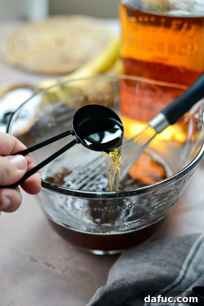 Golden Maple Bourbon Banana Pudding Cake 16 Mixing brown sugar and hot water for pudding sauce