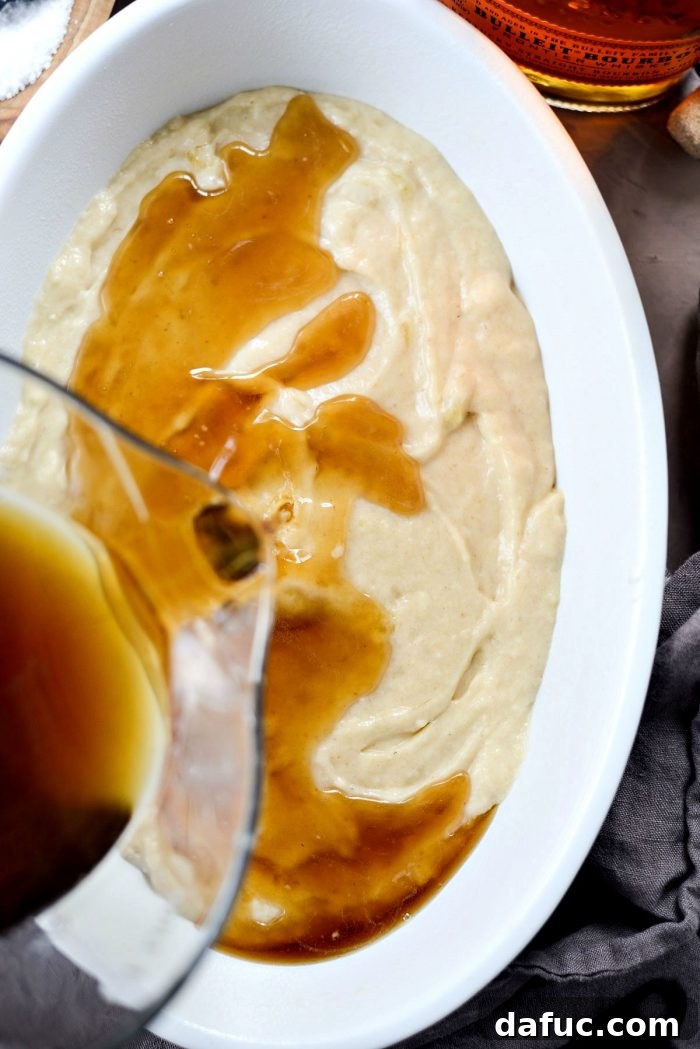 Golden Maple Bourbon Banana Pudding Cake 18 Whisking maple bourbon sauce until sugar dissolves