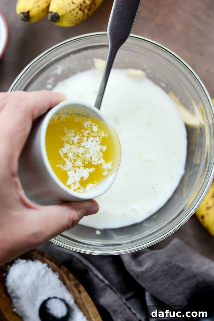 Golden Maple Bourbon Banana Pudding Cake 9 Adding milk to mashed banana