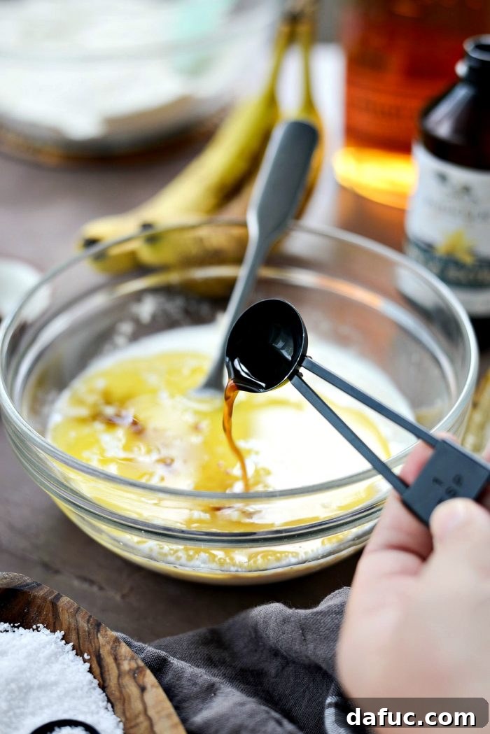 Golden Maple Bourbon Banana Pudding Cake 10 Adding melted butter to banana mixture