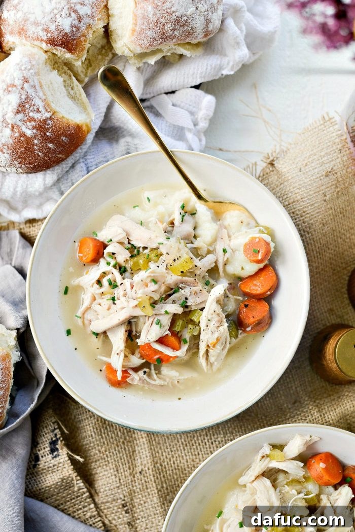 Slow cooker chicken and vegetables served with a side of mashed potatoes