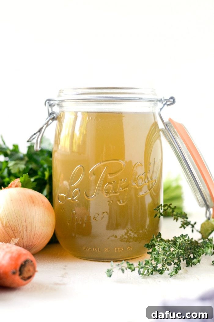 Deeply Flavored Slow Cooker Chicken Broth 2 Slow Cooker Chicken Stock l SimplyScratch.com #homemade #fromscratch #slowcooker #chickenstock #chicken #simplyscratch