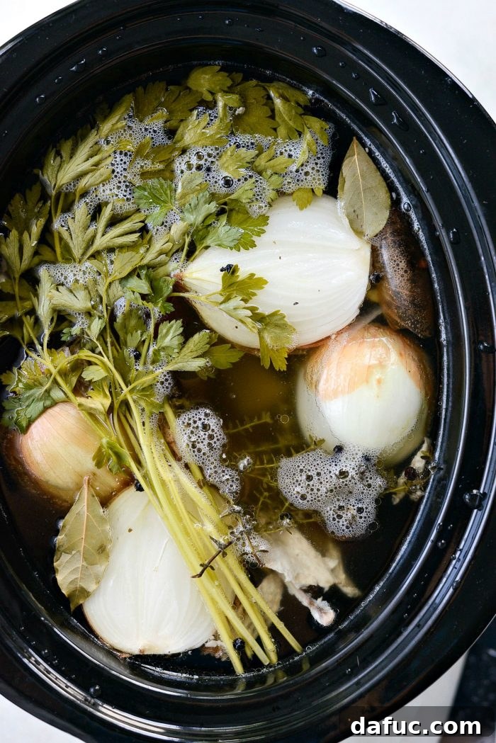 Deeply Flavored Slow Cooker Chicken Broth 12 Straining slow cooker chicken stock