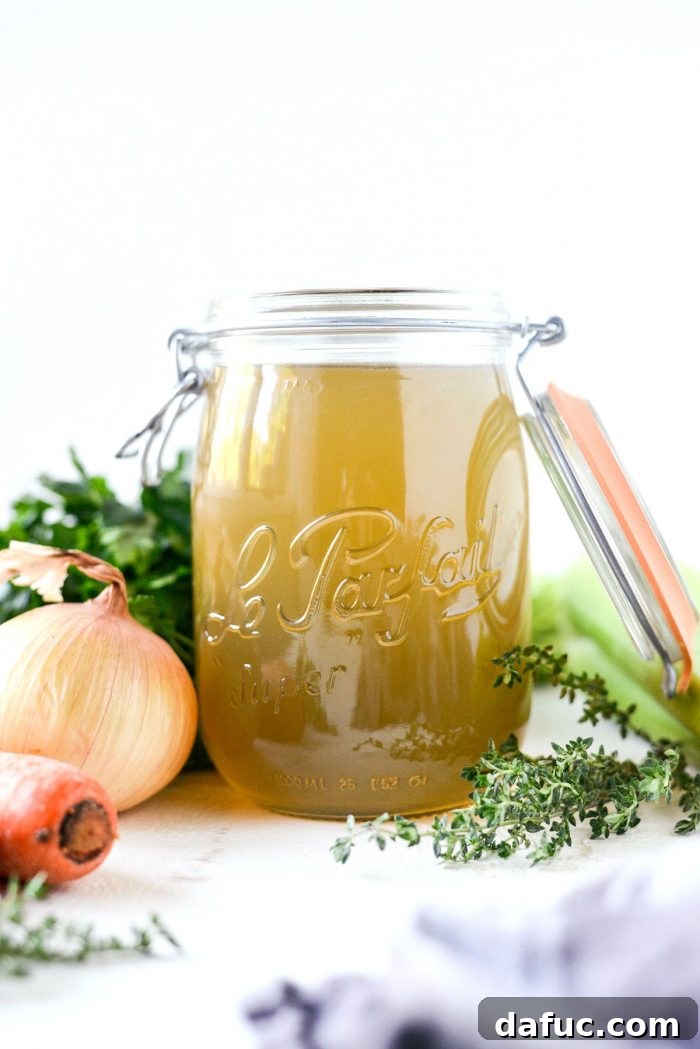 Low & Slow Chicken Broth 13 Frozen homemade chicken stock in individual portions, showcasing effective storage for future use. #frozenstock #stockstorage #mealprep