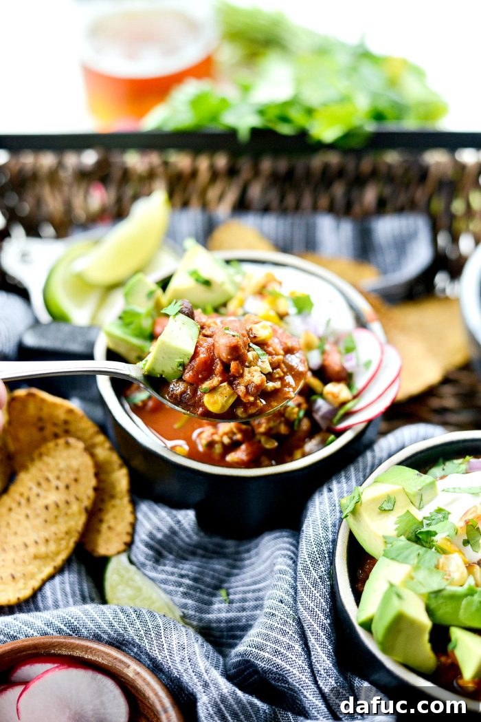 Delicious Southwest Three Bean Chicken Chili in a bowl with colorful toppings