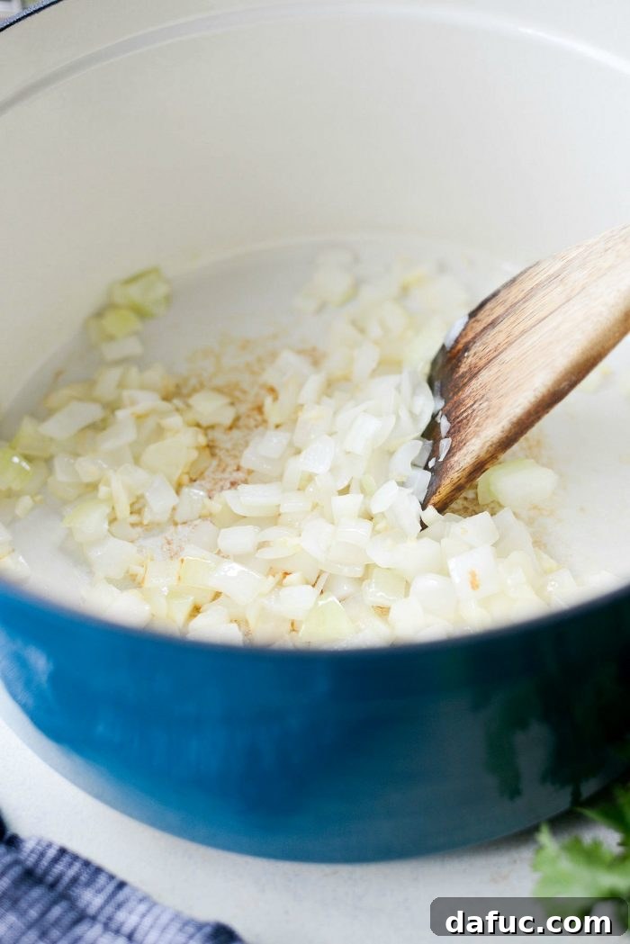 Sautéing aromatic vegetables for the base of a flavorful chili