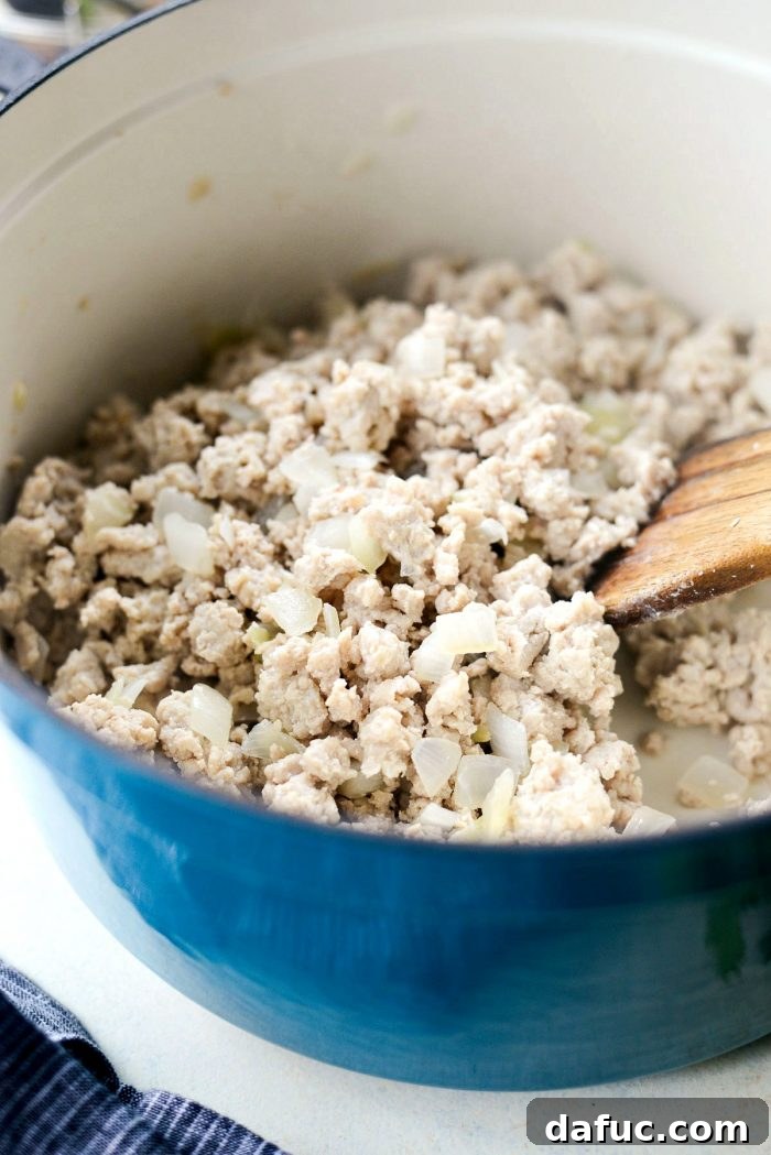 Cooked ground chicken, ready for the next chili ingredients