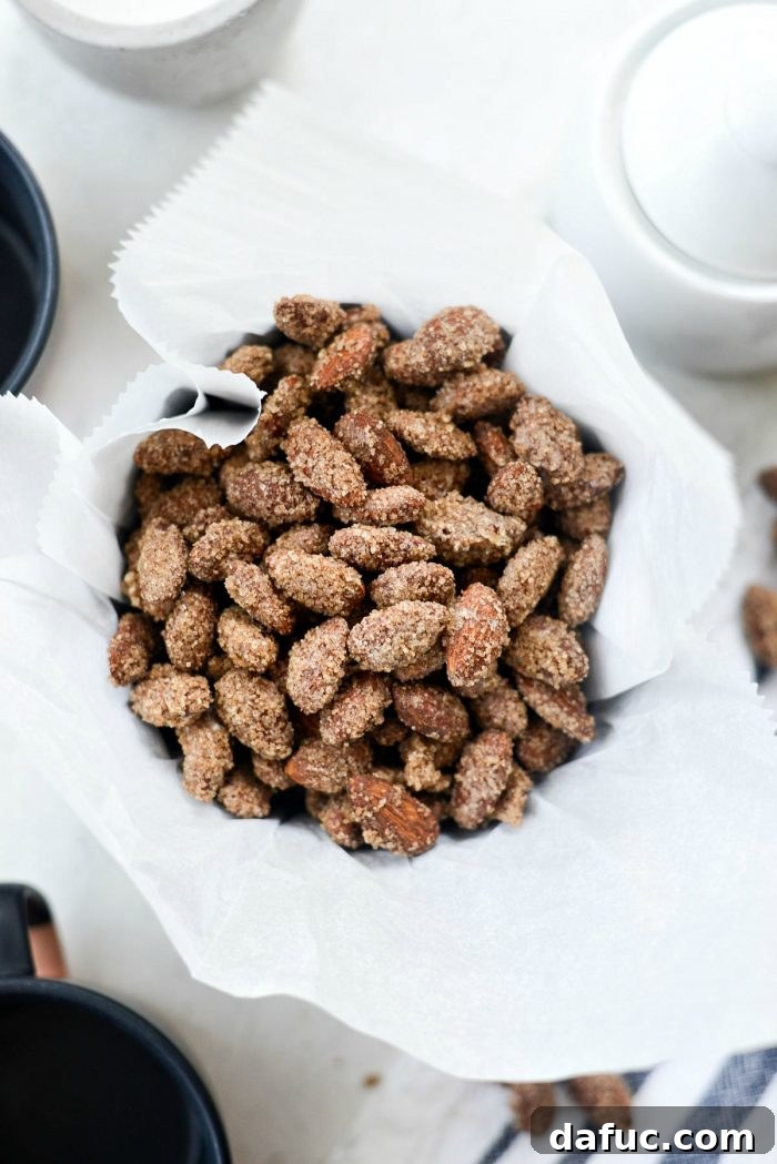 Irresistible Cinnamon Sugar Almonds 2 Delicious homemade cinnamon sugar almonds piled high, ready to be enjoyed as a holiday snack or festive treat.