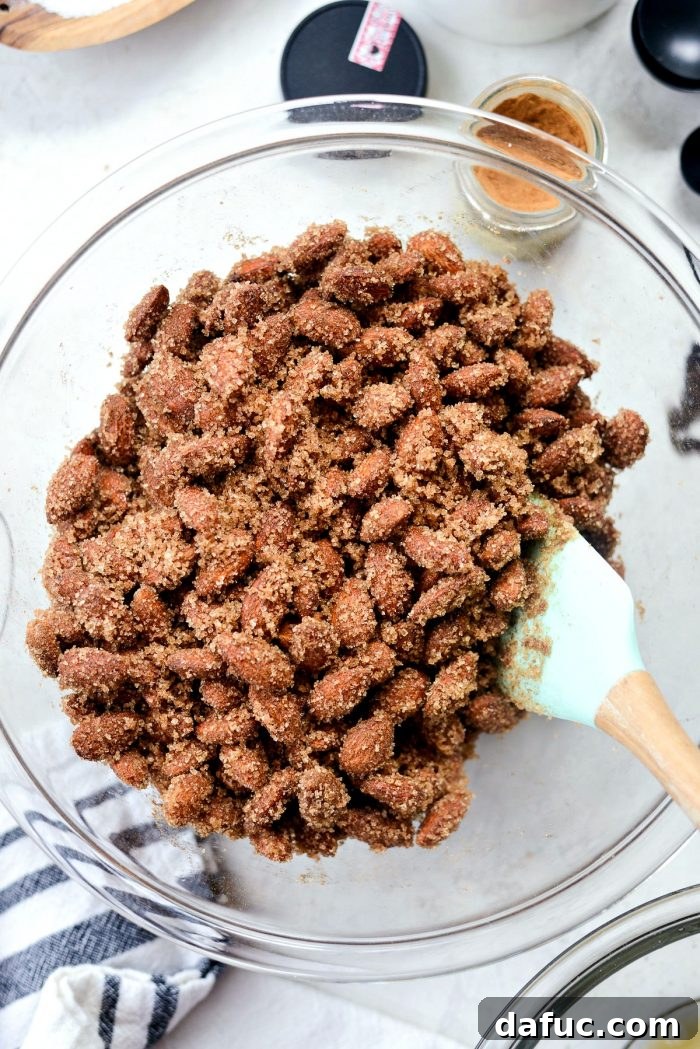 Irresistible Cinnamon Sugar Almonds 10 Almonds coated in egg white are added to the cinnamon sugar mixture, ready for a thorough coating.