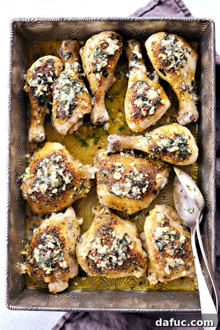 Crispy Garlic Parmesan Baked Chicken 11 Parmesan Garlic Baked Chicken removed from oven, topped with golden crispy Parmesan and herbs.