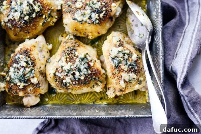 Crispy Garlic Parmesan Baked Chicken 15 Close-up of golden brown Parmesan Garlic Baked Chicken, showcasing the crispy skin and herb topping.