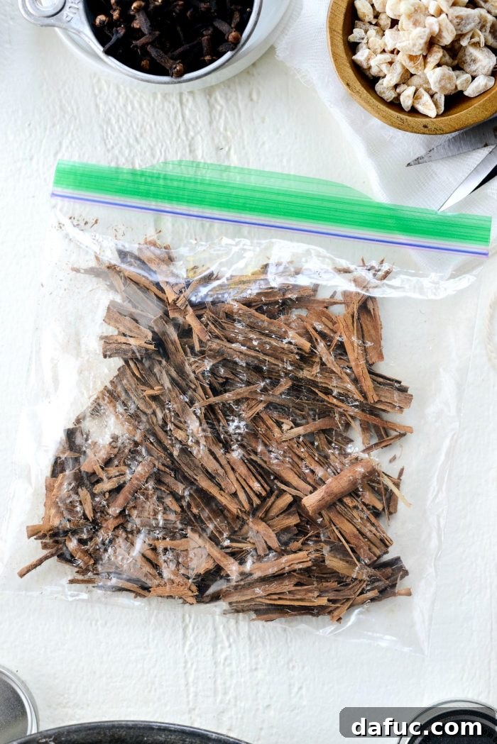Handcrafted Mulling Spice Sachets 7 Crushing cardamom pods with a meat tenderizer