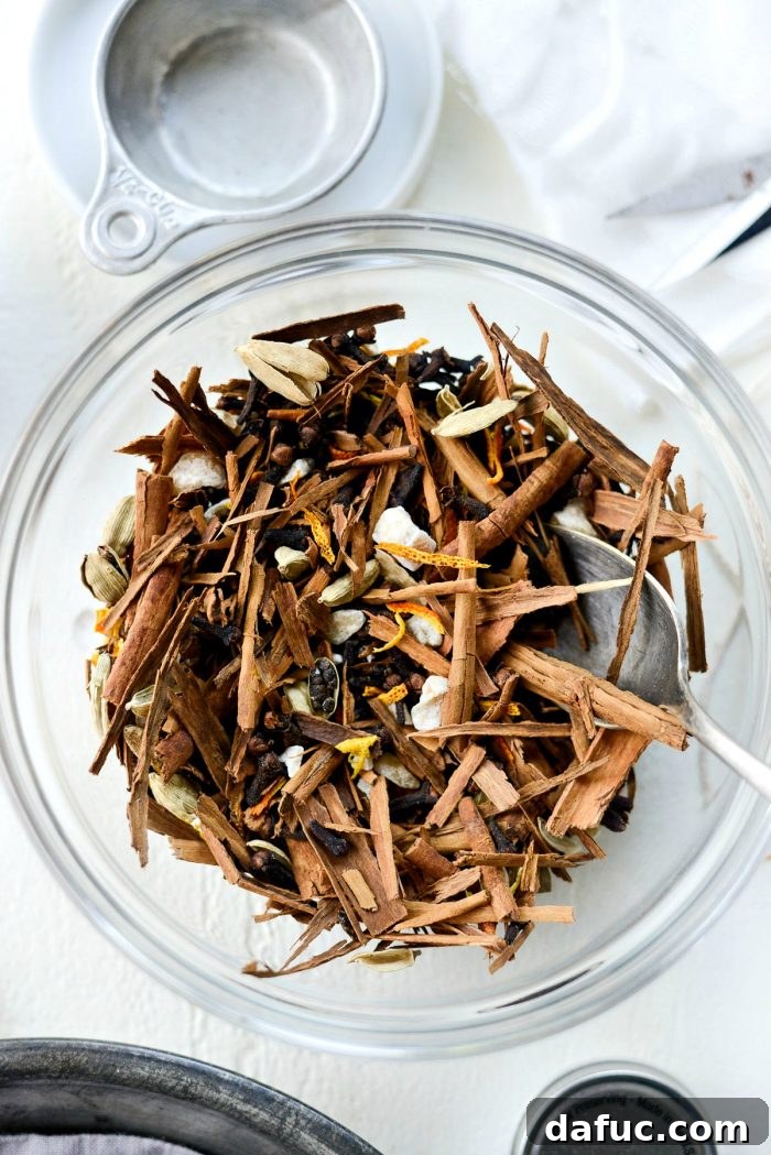 Handcrafted Mulling Spice Sachets 9 Mixing all mulling spices in a bowl: cinnamon, cardamom, cloves, ginger, and citrus peel
