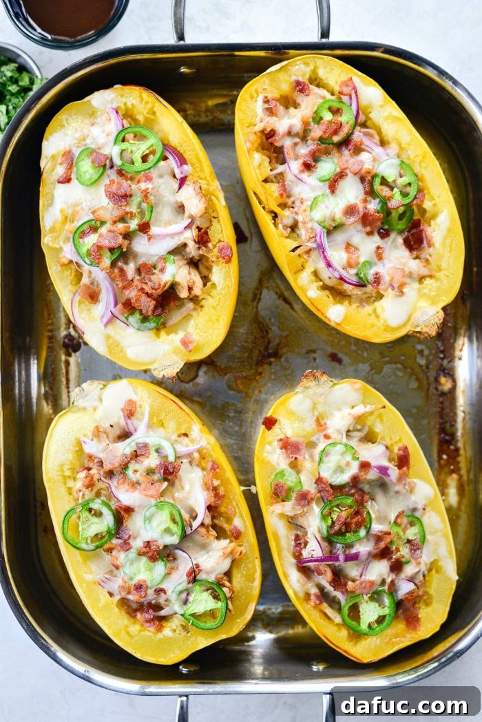 Baked Chicken Bacon Jalapeño Spaghetti Squash, showing melted golden cheese and crispy toppings, fresh out of the oven.