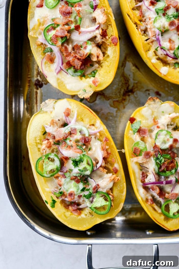 Finished Chicken Bacon Jalapeño Spaghetti Squash, garnished with fresh cilantro and extra crispy onions, ready to be served.