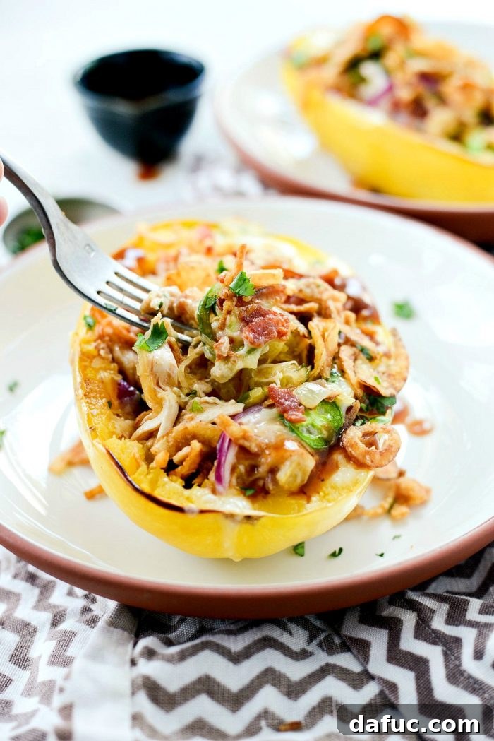 Overhead view of Chicken Bacon Jalapeño Spaghetti Squash, showcasing the rich filling and beautifully melted cheese, ready to eat.