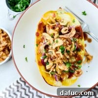 Chicken Bacon Jalapeño Spaghetti Squash - a healthy and flavorful stuffed squash recipe with BBQ chicken, crispy bacon, and spicy jalapeño. Perfect for dinner!