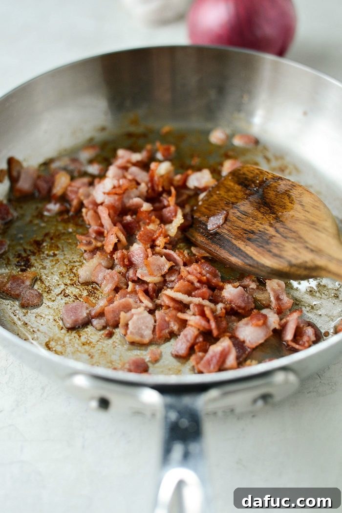Crispy bacon pieces in a small skillet after cooking, ready to be added to the chicken bacon jalapeño spaghetti squash filling.