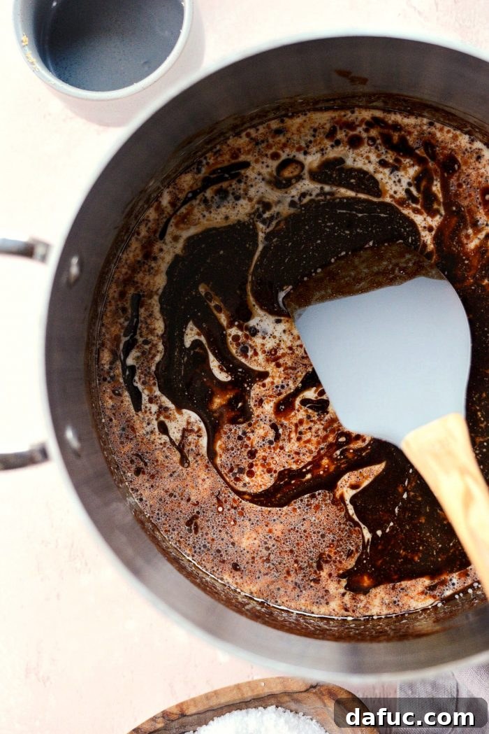 Gourmet Brownie Crisps 6 Melting chocolate and butter in a saucepan on low heat