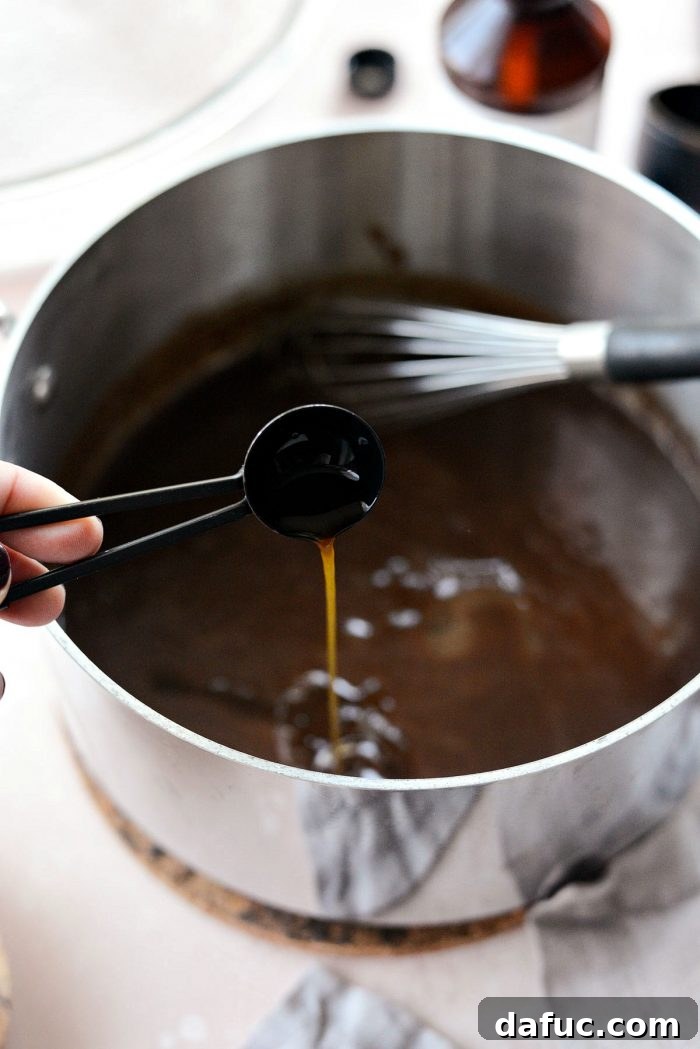 Gourmet Brownie Crisps 8 Egg white being whisked into cooled chocolate mixture for brownie brittle