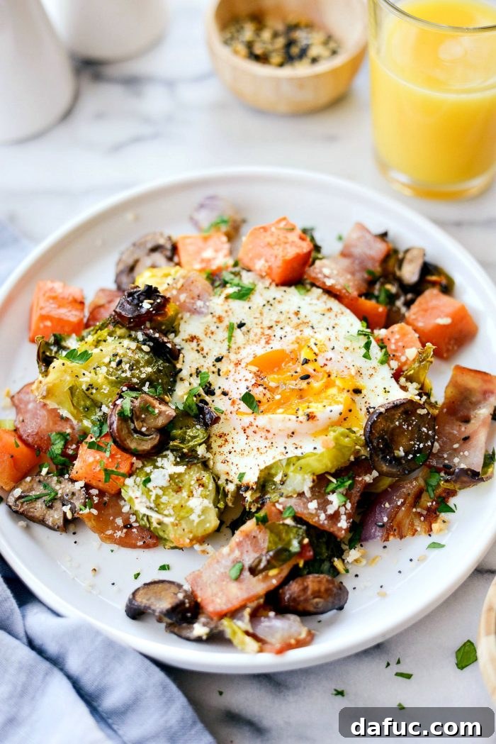 Beautifully plated Sheet Pan Breakfast Hash with garnishes, ready to be enjoyed as a hearty and healthy breakfast or brunch.