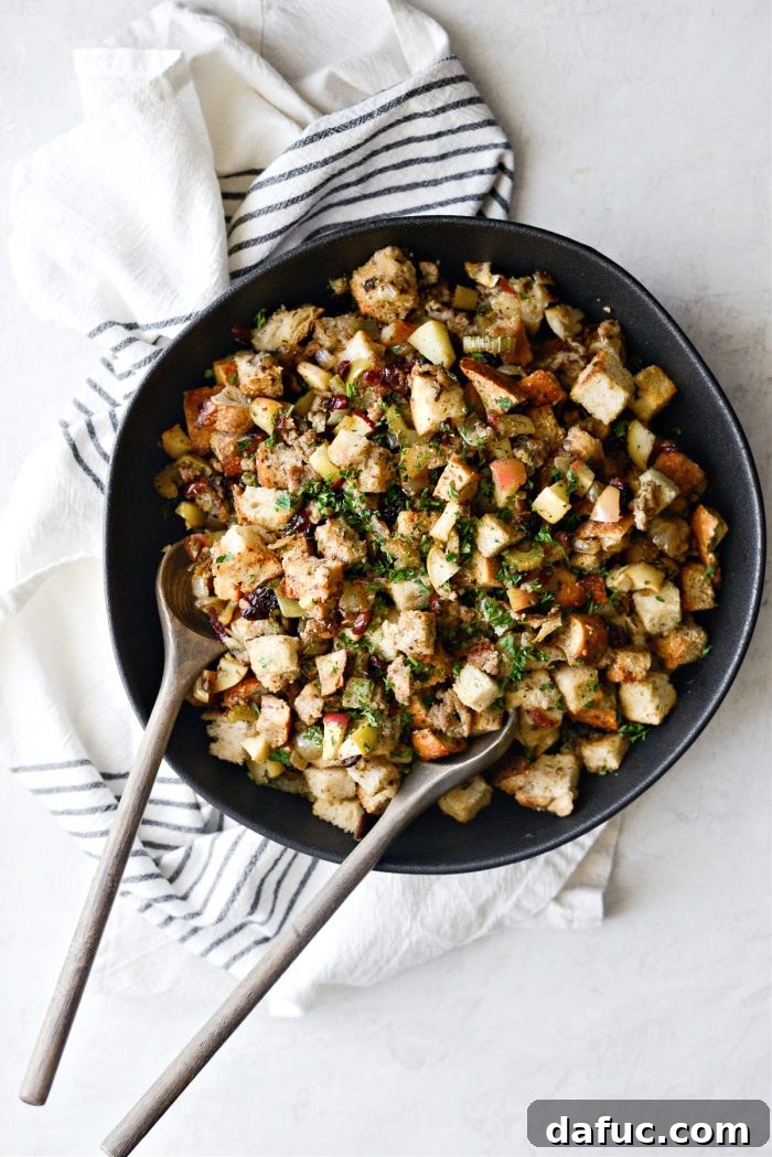 A scoop of Sausage Apple Cranberry Stuffing on a plate, ready to be enjoyed.
