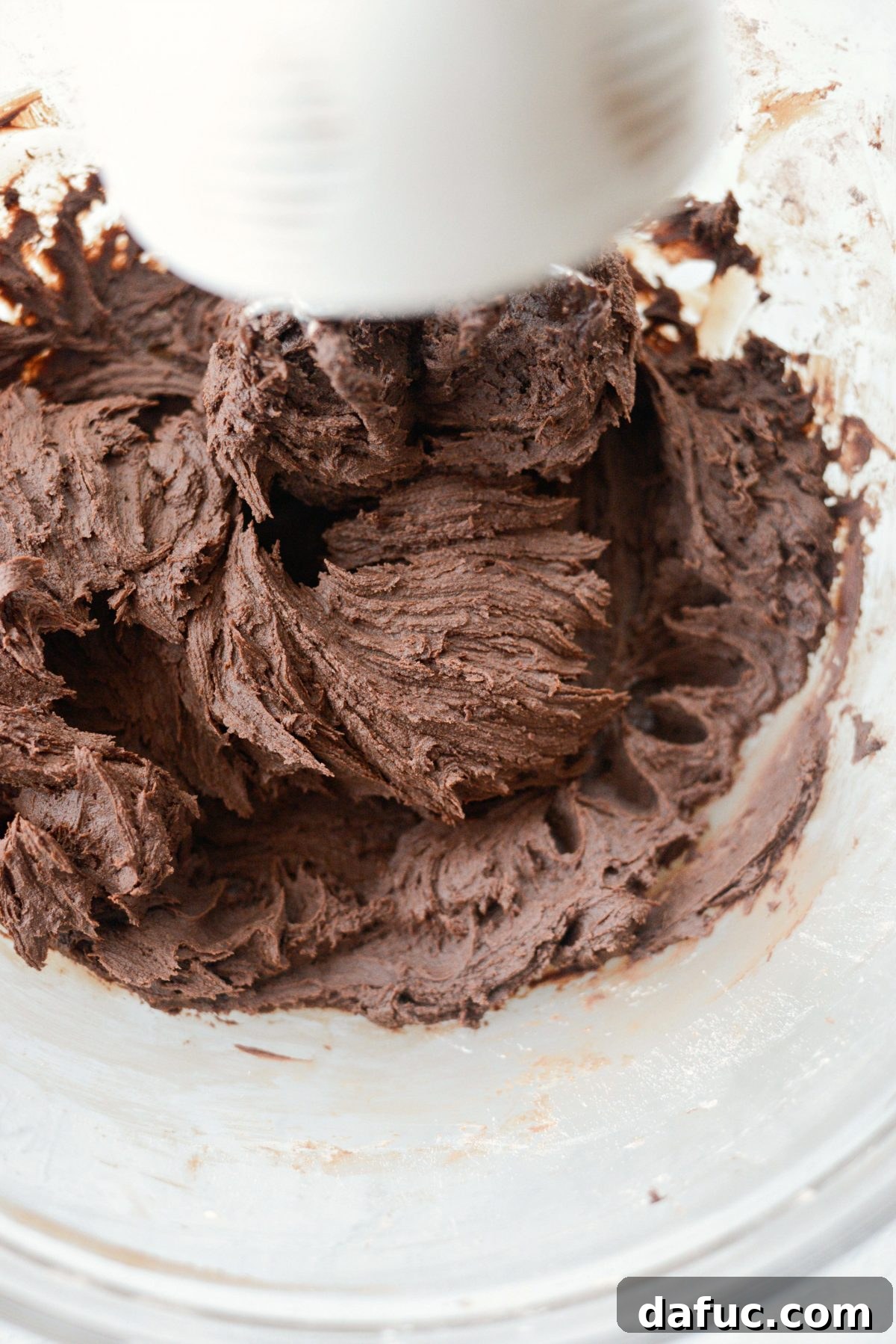 Silky Smooth Chocolate Frosting 14 Final addition of vanilla extract to the perfect homemade chocolate frosting.