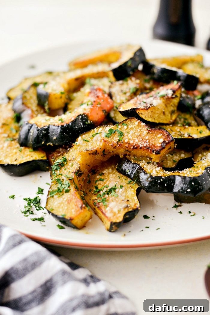 Parmesan Herb Roasted Acorn Squash on a serving plate.