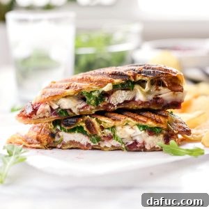 Golden Pressed Turkey Cranberry Croissant 13 Turkey Cranberry Croissant Panini l SimplyScratch.com #leftover #turkey #recipe #sandwich #panini #cranberry #bacon #thanksgiving #thanksgivinglefoterrecipes
