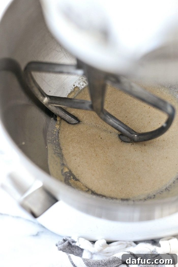 Adding flour and salt to a bowl for the homemade dinner rolls recipe.