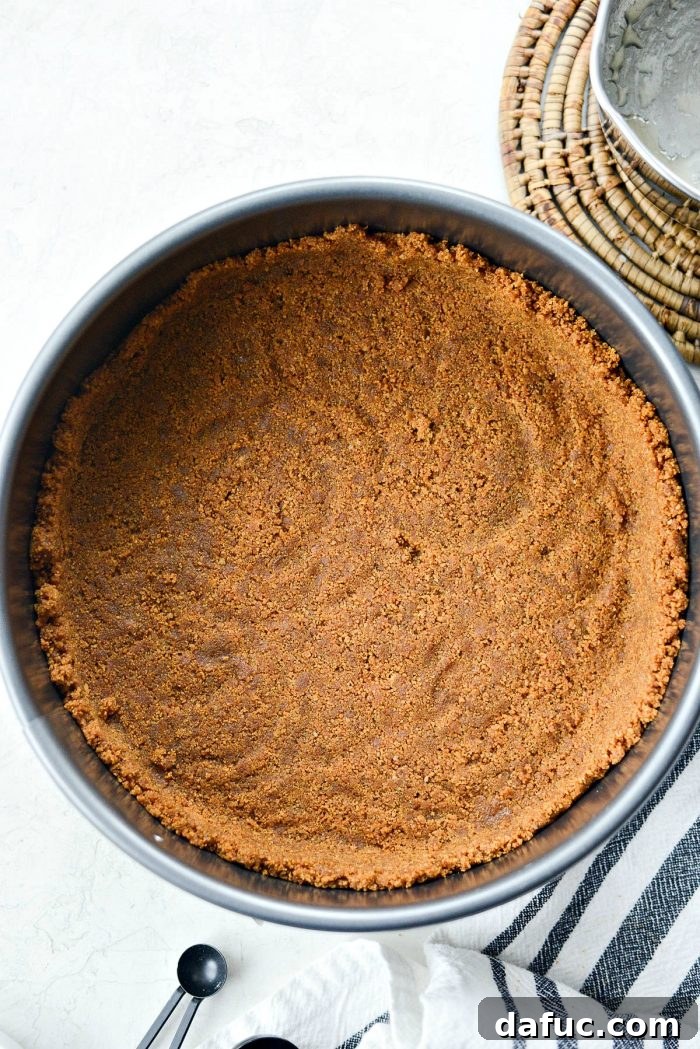 Dreamy No-Bake Pumpkin Cheesecake with a Gingersnap Crunch 8 Pressing Gingersnap Crust into a Springform Pan