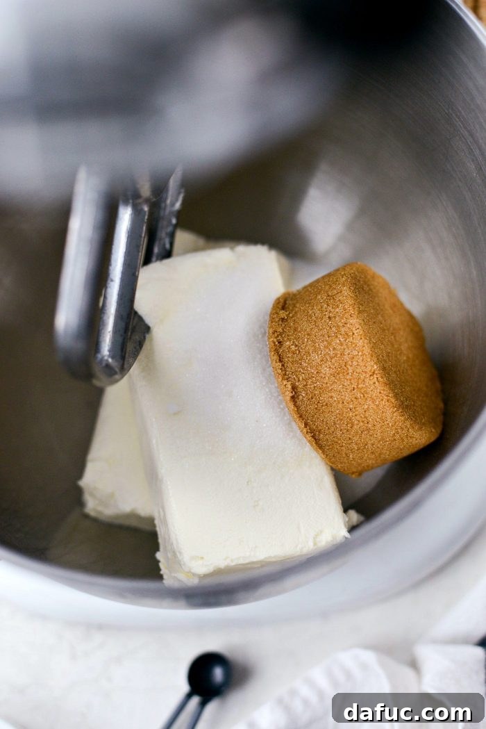 Dreamy No-Bake Pumpkin Cheesecake with a Gingersnap Crunch 9 Softened Cream Cheese and Sugars in a Stand Mixer