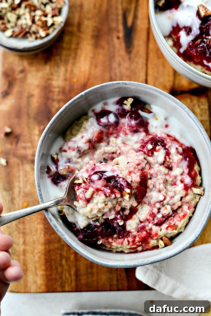 Zesty Cranberry Orange Steel Cut Oats 2 Cranberry Orange Steel Cut Oats, a healthy and creamy breakfast recipe topped with leftover cranberry sauce, vanilla yogurt, and toasted pecans.